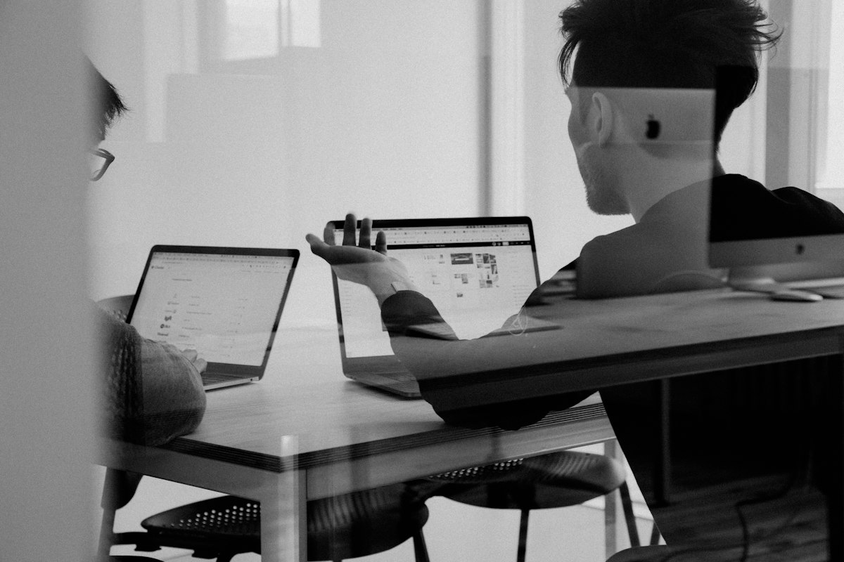 Decinote systems architects reviewing acoustic diarization benchmarks in the Zurich studio
